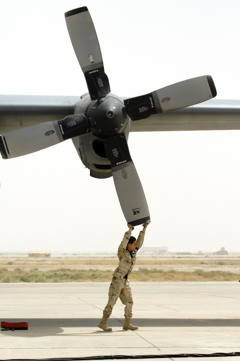 Staff Sgt. Sean Raquepo, 192nd Expeditionary Maintenance Squadron, moves the prop of a C-130H to check the intake and to unlock the engine brake for startup before a flight at Ali Air Base, Iraq, July 14. The 192nd is the only operational Air Force flying unit assigned to Ali Air Base.