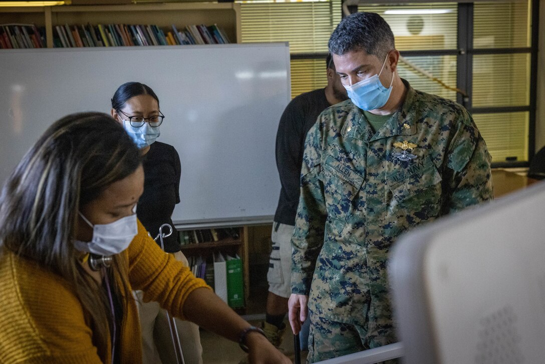 U.S. Navy LCDR Thomas Allen, Emergency Medicine Physician for Koa Moana 23, assists with point of care ultrasound training at Belau National Hospital on Koror, Republic of Palau, Sept. 8, 2023. The United States and the Republic of Palau continue to enhance interoperability by providing regional security, real-world training and community relations projects while forward deployed in the Indo-Pacific area of responsibilities during MCED – Palau 23.2. (U.S. Marine Corps photo by SSgt. David Bickel)