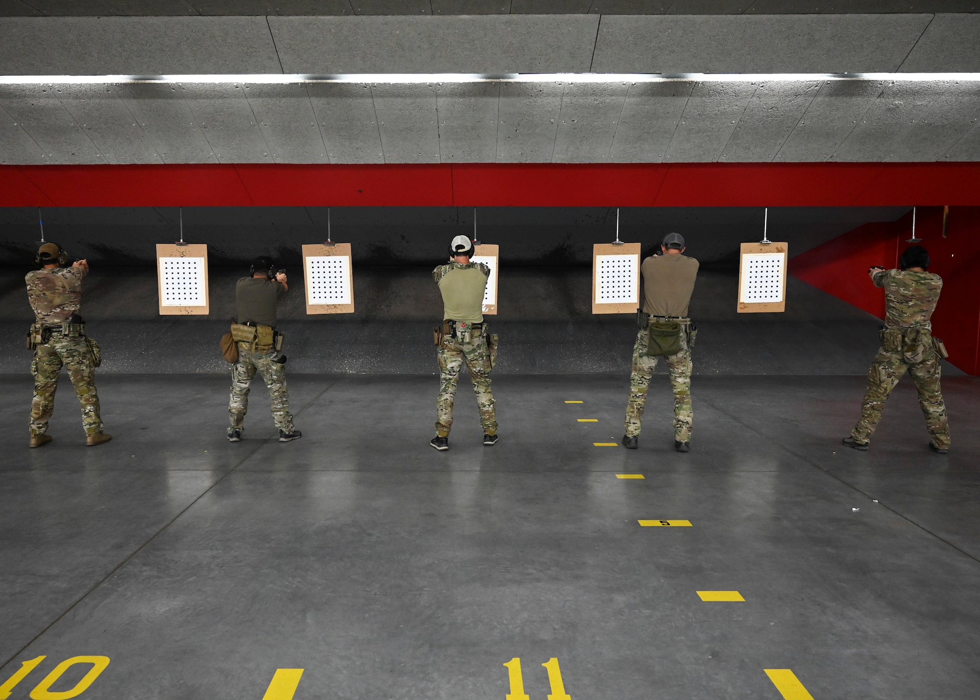 U.S. Air Force tactical air control party Airmen with the 5th Air Support Operations Squadron and U.S. Army Green Berets with the 1st Special Forces Group (Airborne) fire M17 weapon systems at Joint Base Lewis-McChord, Washington, Sept. 8, 2023. This training provided an opportunity for the 5th ASOS and 1st SFG (A) to integrate, furthering their relationship and lethality as a joint force. (U.S. Air Force photo by Senior Airman Callie Norton)