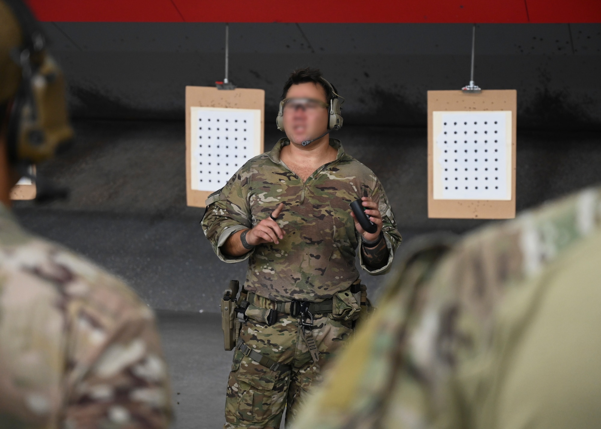 A U.S. Army Green Beret with the 1st Special Forces Group (Airborne) provides instruction for a drill exercise during a pistol accuracy course at Joint Base Lewis-McChord, Washington, Sept. 8, 2023. The 1st SFG (A) has a long and storied history serving the Nation during peacetime and war. Stationed at JBLM, the 1st SFG (A) is the lead Special Forces Group on operations in Asia and the Pacific. (U.S. Air Force photo by Senior Airman Callie Norton)