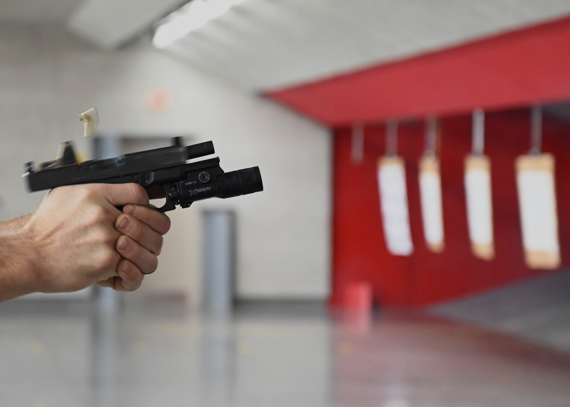 A U.S. Army Green Beret with the 1st Special Forces Group fires an M17 weapon system during a pistol accuracy course at Joint Base Lewis-McChord, Washington, Sept. 8, 2023. This training provided an opportunity for the 1st SFG (A) and 5th Air Support Operations Squadron to integrate, furthering their relationship and lethality as a joint force. (U.S. Air Force photo by Senior Airman Callie Norton)