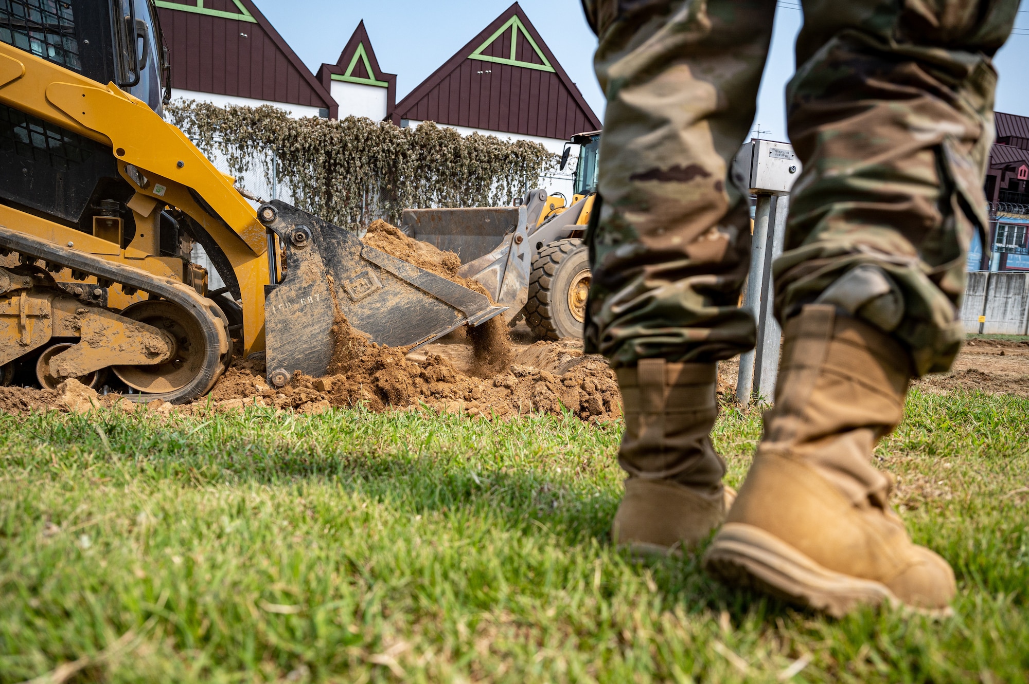 U.S. Air Force Senior Airman Abrein Dunn, 51st Civil Engineer Squadron pavements and equipment journeyman, supervises a construction project at Osan Air Base, Republic of Korea, Sept. 11, 2023. The 51st CES pavements and equipment Airmen, commonly referred to as Dirt Boyz, are proficient in operating heavy construction machinery making them pivotal for managing diverse construction and maintenance projects essential to the base's operational readiness. (U.S. Air Force photo by Staff Sgt. Thomas Sjoberg)