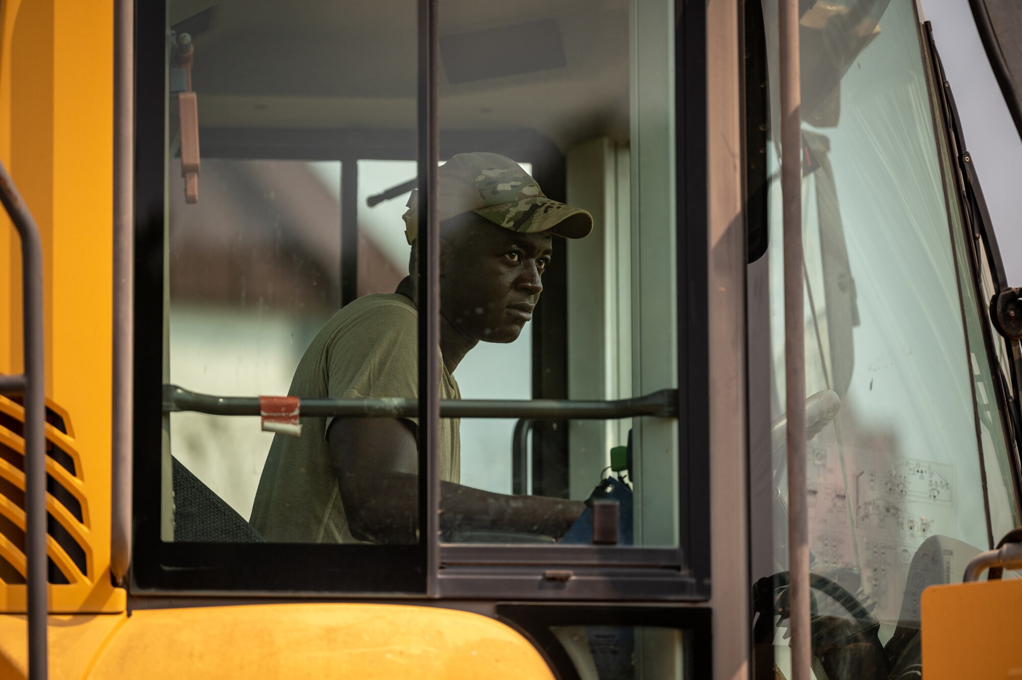 U.S. Air Force Senior Airman Fomba Kamara, 51st Civil Engineer Squadron pavements and equipment journeyman, operates a front-end loader at Osan Air Base, Republic of Korea, Sept. 11, 2023. Pavements and construction Airmen, dubbed Dirt Boyz, ensure airfield pavements and critical surfaces are in peak condition, enabling 51st Fighter Wing aircraft to take flight and accomplish the mission. (U.S. Air Force photo by Staff Sgt. Thomas Sjoberg)