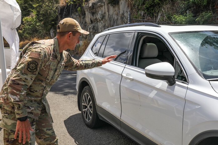 Joint Task Force-Red Hill (JTF-RH) Access Control Point (ACP) team member, U.S. Air National Guard Senior Airman Ethan Nopuente, ensures accountability of personnel at the Red Hill Bulk Fuel Storage Facility (RHBFSF) ACP, Halawa, Hawaii, Sept. 12, 2023.