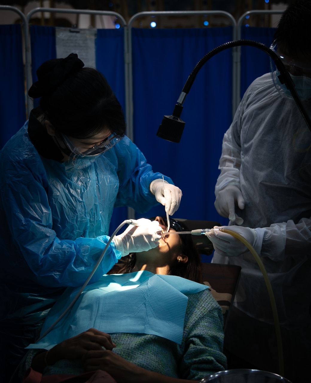 Dental cleanings at a community health fair  during Pacific Partnership 2023.