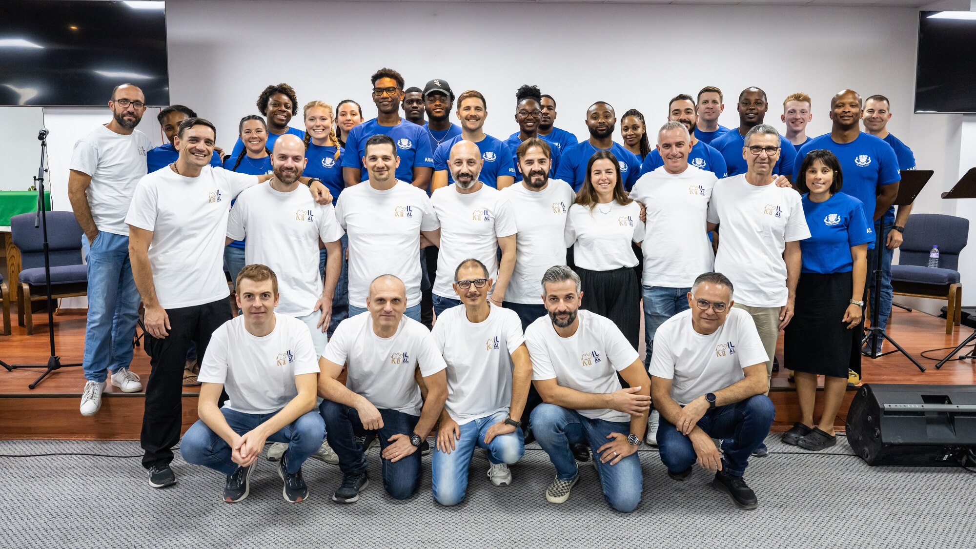 Service members from the 386th Air Expeditionary Wing chapel praise team (back row), and the Italian choir gather for a group photo before hosting a coalition worship event at the chapel at Ali Al Salem Air Base, Kuwait, Sept. 13, 2023. U.S. and partner nation forces from across the base came together for a night of song and prayer to bolster their spiritual fitness and cultivate the inclusiveness that power our enduring partnerships. (U.S. Air Force photo by Staff Sgt. Kevin Long)