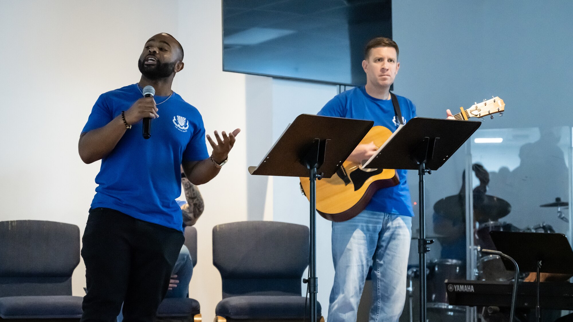 U.S. Air Force Tech Sgt. Rodrick Chandler, 386th Air Expeditionary Wing Equal Opportunity regional director (left) and Master Sgt. Robert Smith, 386th Expeditionary Communications Squadron first sergeant, perform a song together during a coalition worship event at the chapel at Ali Al Salem Air Base, Kuwait, Sept. 13, 2023. U.S. and partner nation forces from across the base came together for a night of song and prayer to bolster their spiritual fitness and cultivate the inclusiveness that power our enduring partnerships. (U.S. Air Force photo by Staff Sgt. Kevin Long)