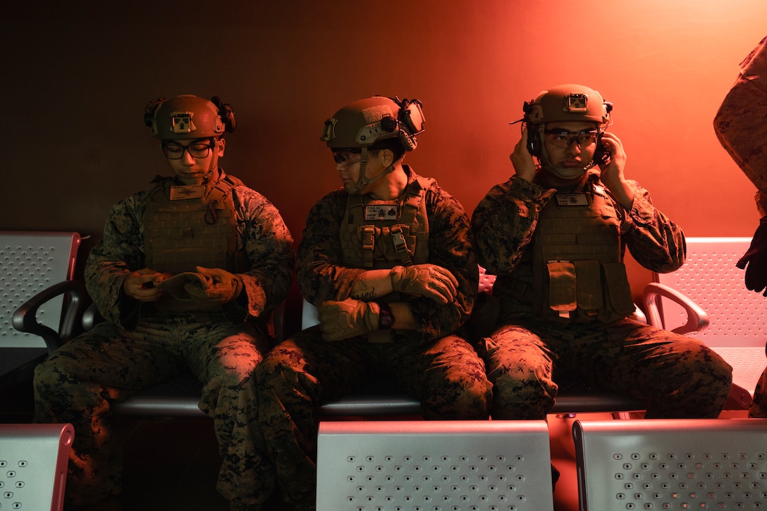 U.S. Marines with Marine Rotational Force-Southeast Asia (MRF-SEA), I Marine Expeditionary Force, conduct pre-combat checks before a 100-meter live-fire range during Exercise Valiant Mark 2022 at the Multi-Mission Range Complex on Pasir Laba Camp, Singapore, Dec. 2, 2022. Valiant Mark is an annual, bilateral training exercise designed to enhance interoperability, build mutual defense capabilities, and strengthen military-to-military relationships between the U.S. Marine Corps and Singapore Armed Forces. MRF-SEA is an operational model developed by Marine Corps Forces Pacific that postures scalable I Marine Expeditionary Forces west of the International Date Line, conducts a series of planned subject matter experts exchanges, and advances security objectives shared with our Allies and Partners. (U.S. Marine Corps photo by Sgt. Ryan H. Pulliam)