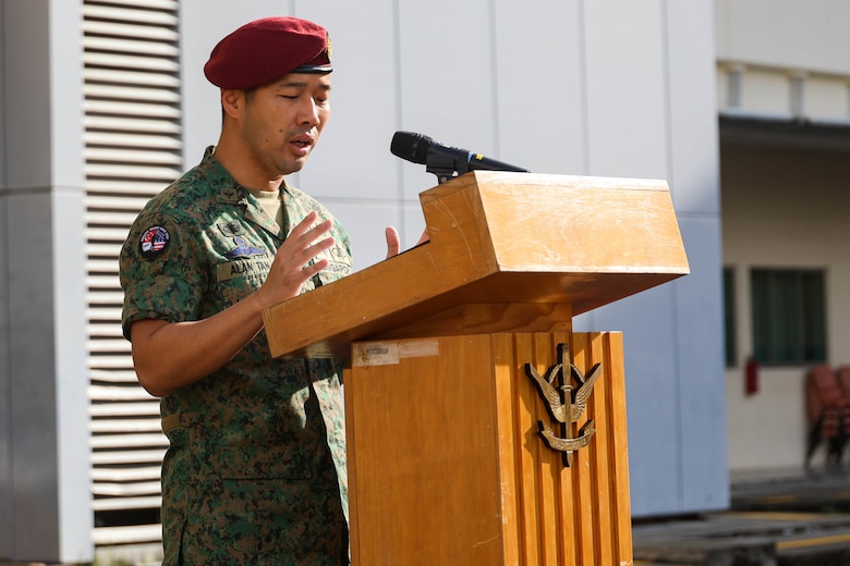 Singapore Guard Col. Tan Yukun Alan, left, commander of 7th Singapore Infantry Brigade, speaks to the armed forces during the closing ceremony for Exercise Valiant Mark 2022 on Bedok Camp II, Singapore, Dec. 6, 2022. Valiant Mark is an annual, bilateral training exercise designed to enhance interoperability, build mutual defense capabilities, and strengthen military-to-military relationships between the U.S. Marine Corps and Singapore Armed Forces. MRF-SEA is an operational model developed by Marine Corps Forces Pacific that postures scalable I Marine Expeditionary Forces west of the International Date Line, conducts a series of planned subject matter expert exchanges, and advances security objectives shared with our Allies and Partners. (U.S. Marine Corps photo by Sgt. Jailine L. AliceaSantiago)