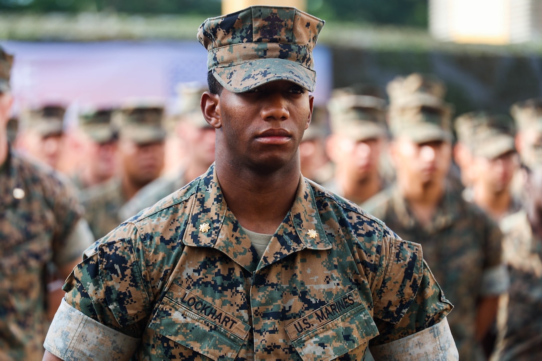 U.S. Marine Corps Maj. Cory Lockhart, expeditionary advanced base force officer-in-charge, with Marine Rotational Force-Southeast Asia (MRF-SEA), I Marine Expeditionary Force, stands formation during the closing ceremony for Exercise Valiant Mark 2022 on Bedok Camp II, Singapore, Dec. 6, 2022. Valiant Mark is an annual, bilateral training exercise designed to enhance interoperability, build mutual defense capabilities, and strengthen military-to-military relationships between the U.S. Marine Corps and Singapore Armed Forces. MRF-SEA is an operational model developed by Marine Corps Forces Pacific that postures scalable I Marine Expeditionary Forces west of the International Date Line, conducts a series of planned subject matter expert exchanges, and advances security objectives shared with our Allies and Partners. (U.S. Marine Corps photo by Sgt. Jailine L. AliceaSantiago)