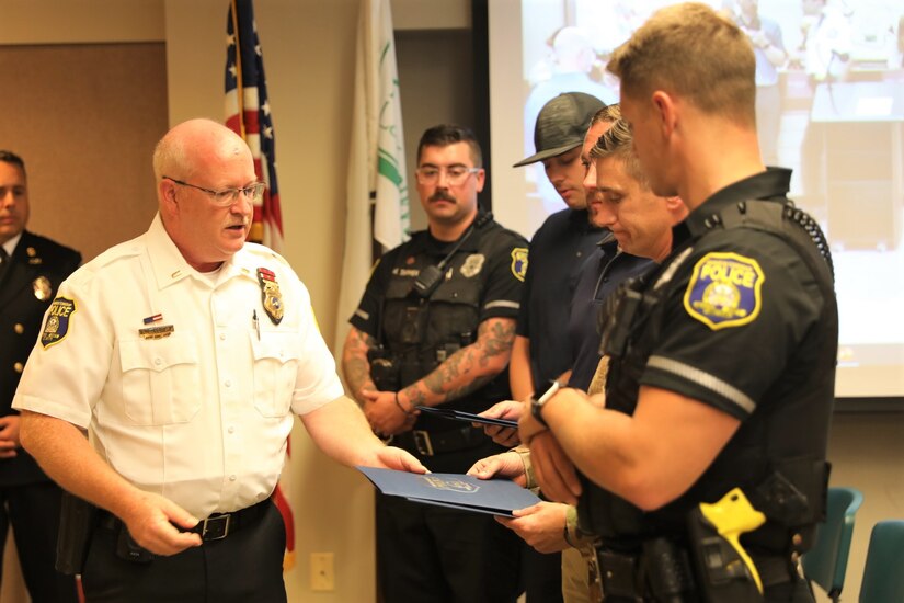 U.S. Army Lt. Col. Mark Martella, firefighter Keith Still, Officers Dylan Canada and Michael Tappen are presented with the Manheim Township Police Department’s Citation for Excellence for the life saving measures taken on June 1, 2023 providing CPR to an unconscious man in Lancaster, pa Aug. 28, 2023. (U.S. Army National Guard photo by 2nd Lt. Kate Kramer)