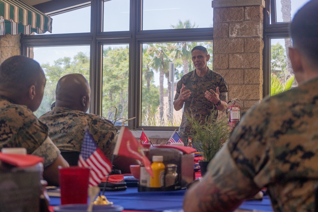 U.S. Marine Corps Sgt. Maj. Gerardo C. Ybarra, the sergeant major of Marine Air Control Group 38, 3rd Marine Aircraft Wing, asks a question to Sgt. Maj. Carlos A. Ruiz, the Sergeant Major of the Marine Corps, during a sergeants major lunch on Marine Corps Air Station Miramar, California, Aug. 16, 2023. The sergeants major lunch provided a platform for 3rd MAW senior enlisted leaders to discuss topics to enhance the Marine Corps' operational excellence. (U.S. Marine Corps photo by Sgt. Joshua Brittenham)