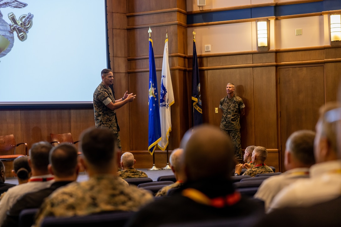 U.S. Marine Corps Sgt. Maj. Carlos A. Ruiz, Sgt. Maj. Of the Marine Corps, speaks to the crowd during the Inspector General of the Marine Corps Training Symposium on Marine Corps Base Quantico, Aug. 29, 2023. The Inspector General of the Marine Corps (IGMC) facilitates Marine Corps efficiency, integrity, and institutional readiness through objective and independent assistance, assessments, inspections, and investigations to enhance the Marine Corps' mission success and the welfare of its Marines, Sailors, and their families. (U.S. Marine Corps photo by Lance Cpl. Ethan Miller)