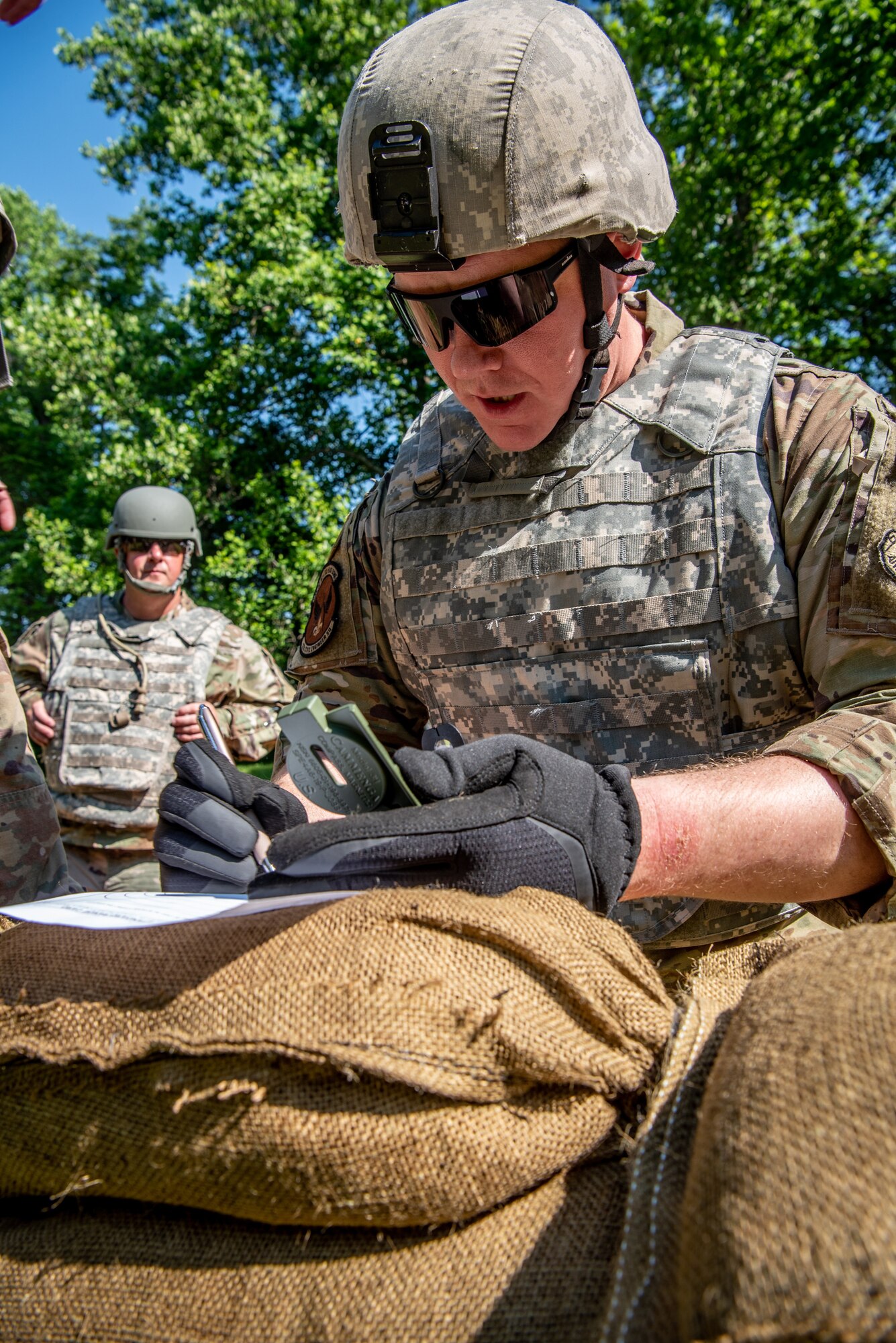 Staff Sgt. Samuel Wurzelbacher, a ventilation and air conditioning technician from the Kentucky Air National Guard’s 123rd Civil Engineer Squadron, fills out a range card during a training exercise in Shepherdsville, Ky., June 2, 2023. The purpose of the training was to promote multi-capable Airmen by training them on skills outside of their primary jobs. (U.S. Air National Guard photo by Tech. Sgt. Joshua Horton)