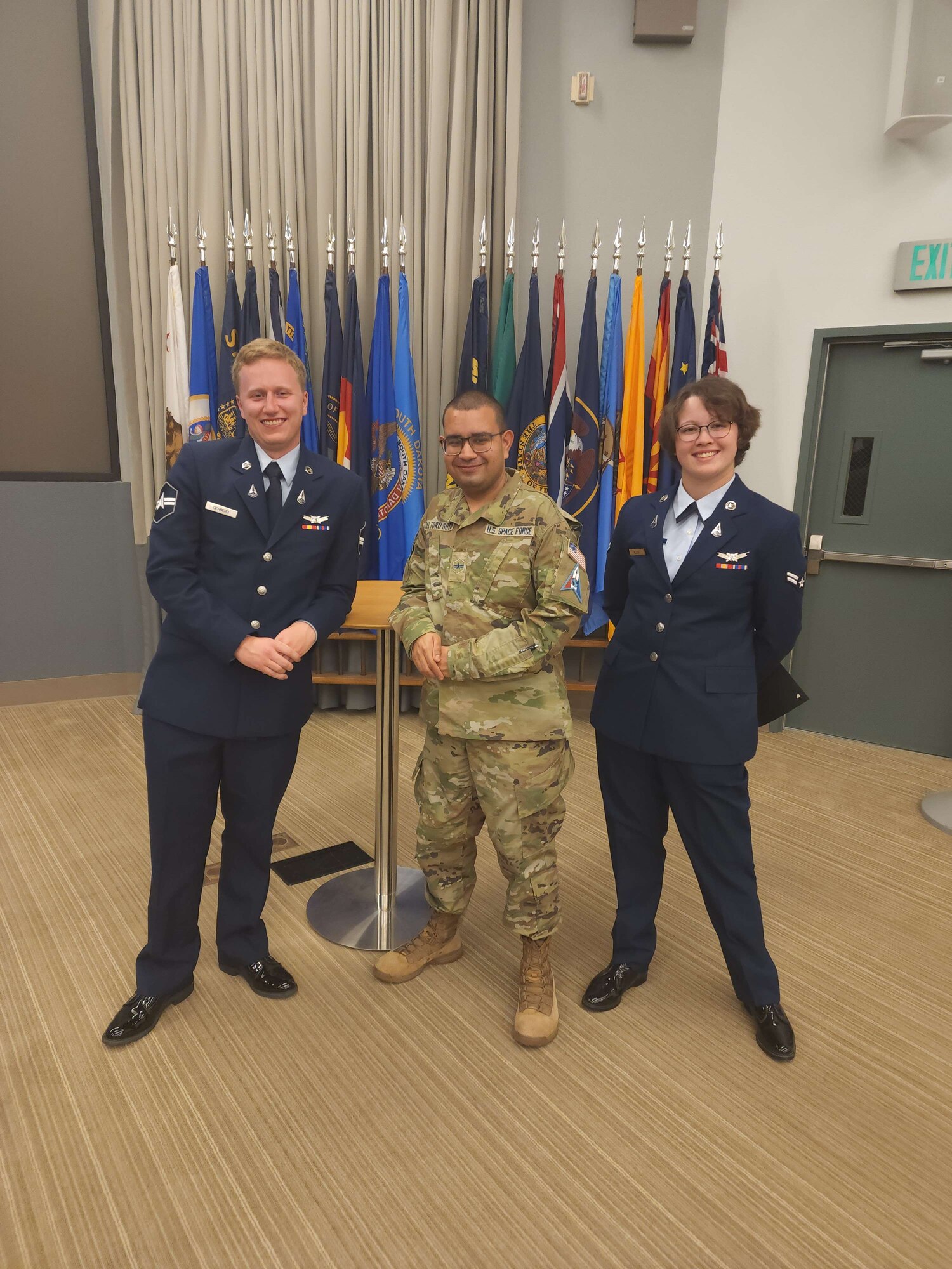 Spc. 3 Freddy Del Toro Soto poses for a photo with two fellow Guardians.