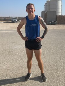 Airman 1st Class Cody Woolley  poses after virtually participating in the Air Force Marathon