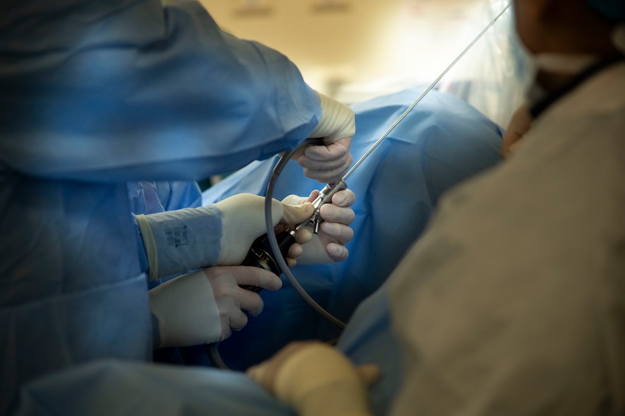 medical professionals gloved hands work with equipment