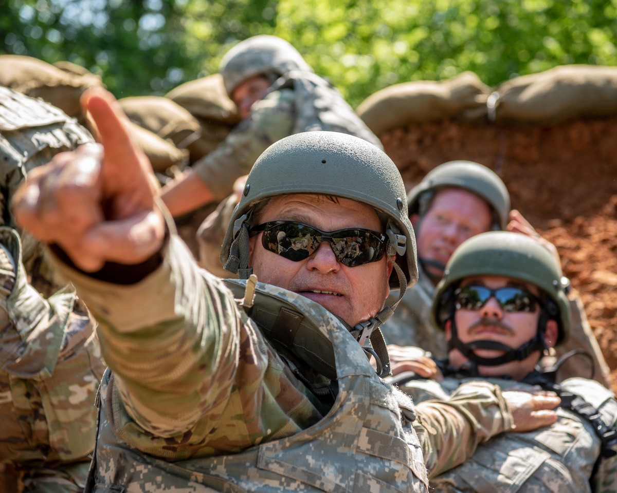 Airmen from the Kentucky Air National Guard’s 123rd Civil Engineer Squadron use defensive fighting positions during a training exercise in Shepherdsville, Ky., June 2, 2023. The purpose of the training was to promote multicapable Airmen by training them on skills outside their primary jobs.