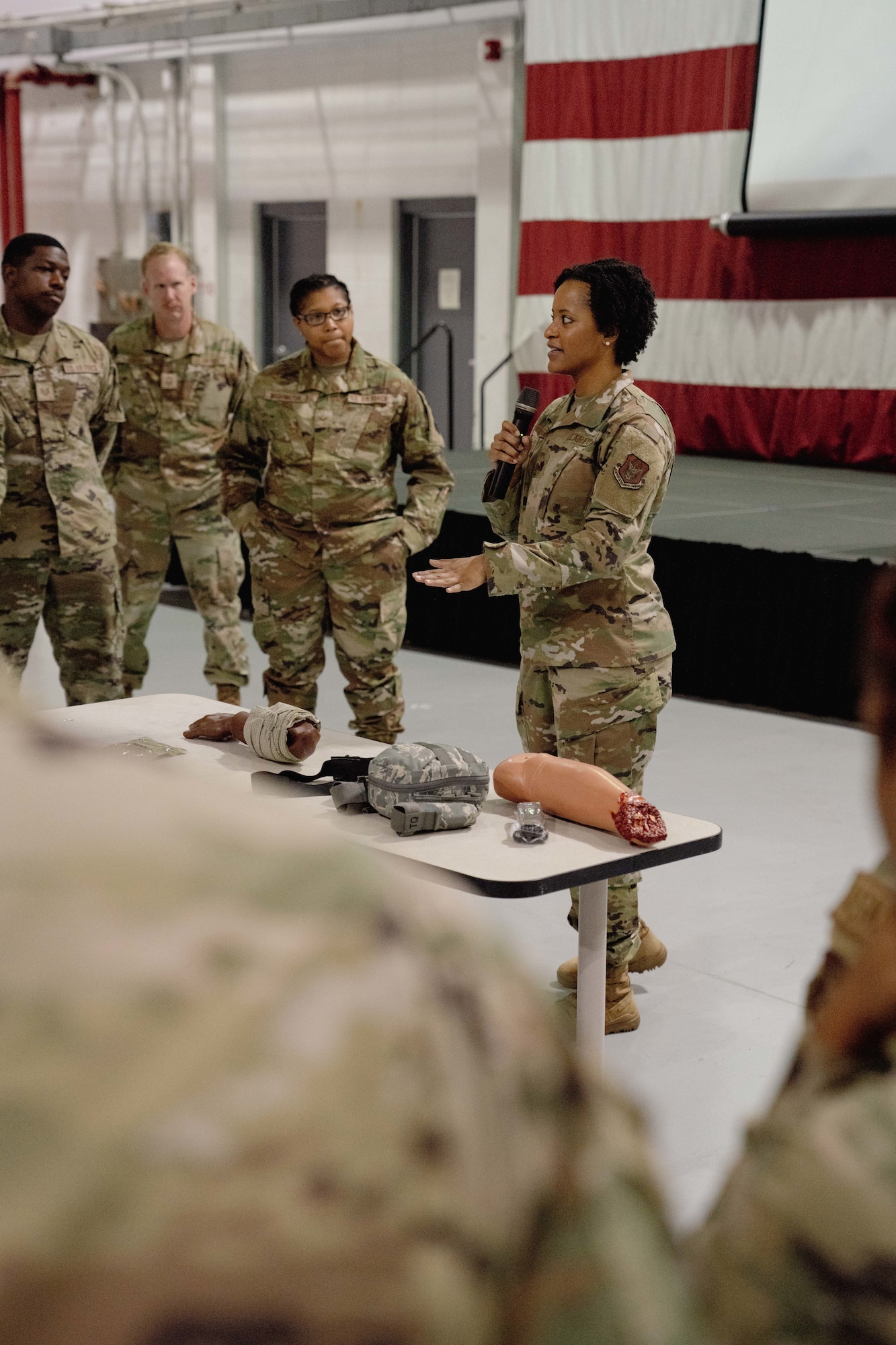 Maj. Arielle Watson, 94th Aeromedical Staging Squadron Wing Tactical Combat Casualty Care program manager, briefs members of the 94th Airlift Wing during TCCC training at Dobbins Air Reserve Base, Ga., Sept. 14, 2023. TCCC training was developed to teach servicemembers evidence-based, life-saving techniques and strategies for providing the best trauma care on the battlefield. (U.S. Air Force photo by Master Sgt. Miles Wilson)