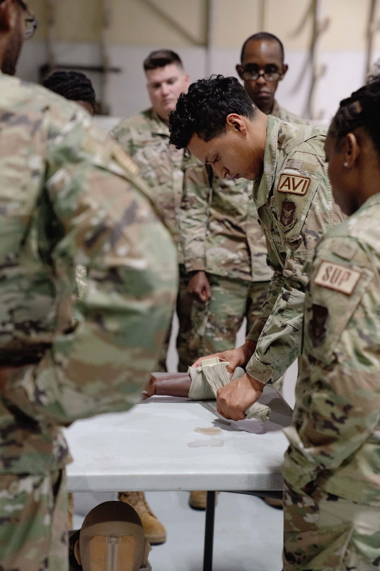 An airman with the 94th Airlift Wing applies a splint during Tactical Combat Casualty Care training at Dobbins Air Reserve Base, Ga., Sept. 14, 2023. The TCCC training was conducted as a part of Warrior Week at Dobbins in order to prepare and equip Airmen to conduct casualty care in deployed combat environments, which could possibly help them end up saving the lives of other fellow servicemembers. (U.S. Air Force photo by Master Sgt. Miles Wilson)