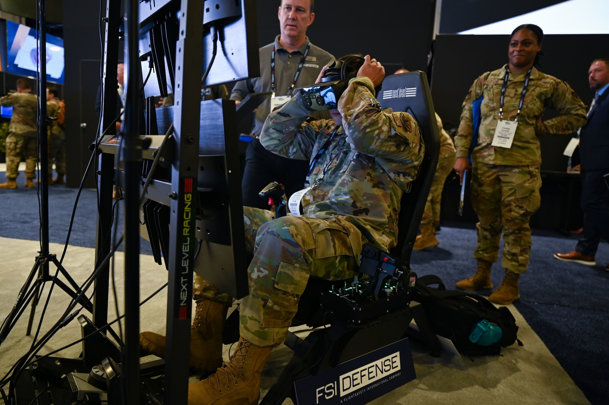 U.S. Air Force Tech Sgt. Carlos Figueroa, 350th Spectrum Warfare Wing section chief wing programs, explores the FSI Defense booth at the Air & Space Forces Association’s (AFA) Air, Space & Cyber Conference exhibitor at the Gaylord National Resort & Convention Center in National Harbor, Md., Sept. 12, 2023. During AFA, Airmen explored more than 230 booths in the technology exhibit hall. (U.S. Air Force photo by Staff Sgt. Ericka A. Woolever)