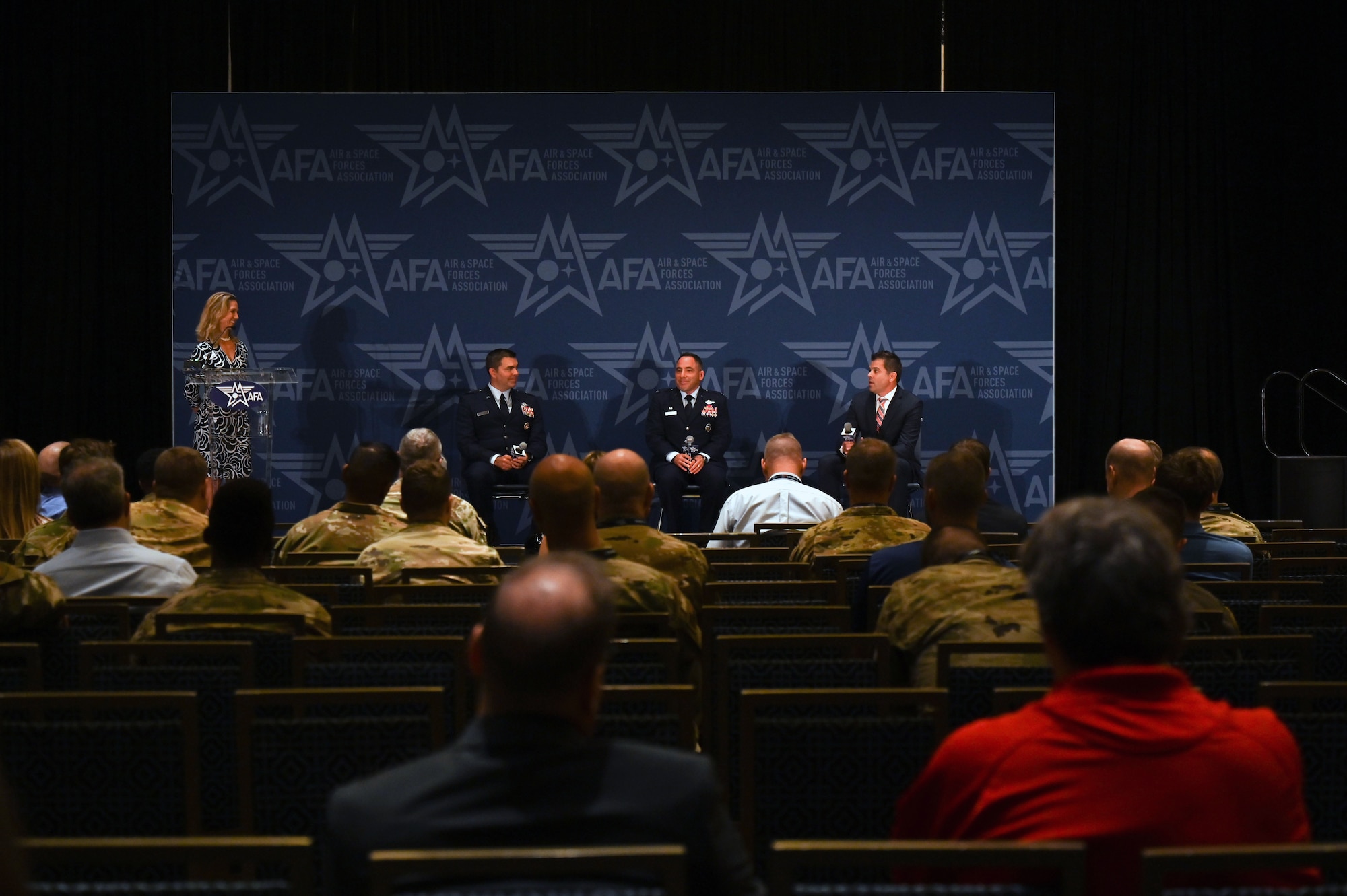 U.S. Air Force Brig. Gen. Richard Goodman, 57th Wing commander, left, U.S. Air Force Col. Josh Koslov, 350th Spectrum Warfare Wing commander, center, and Joshua Niedzwiecki, vice president and general manager of electronic combat solutions, BAE Systems, right, serve as panelists for the Spectrum Renaissance session during the Air & Space Forces Association’s (AFA) Air, Space & Cyber Conference at the Gaylord National Resort & Convention Center in National Harbor, Md., Sept. 13, 2023. During the panel, members discussed how the Spectrum has never been a more congested, contested and constrained domain to operate within. They discussed the dependability between air assets and the EMS as inseparable and the survivability of Airmen depends on the Air Force achieving and maintaining EMS superiority. (U.S. Air Force photo by Staff Sgt. Ericka A. Woolever)