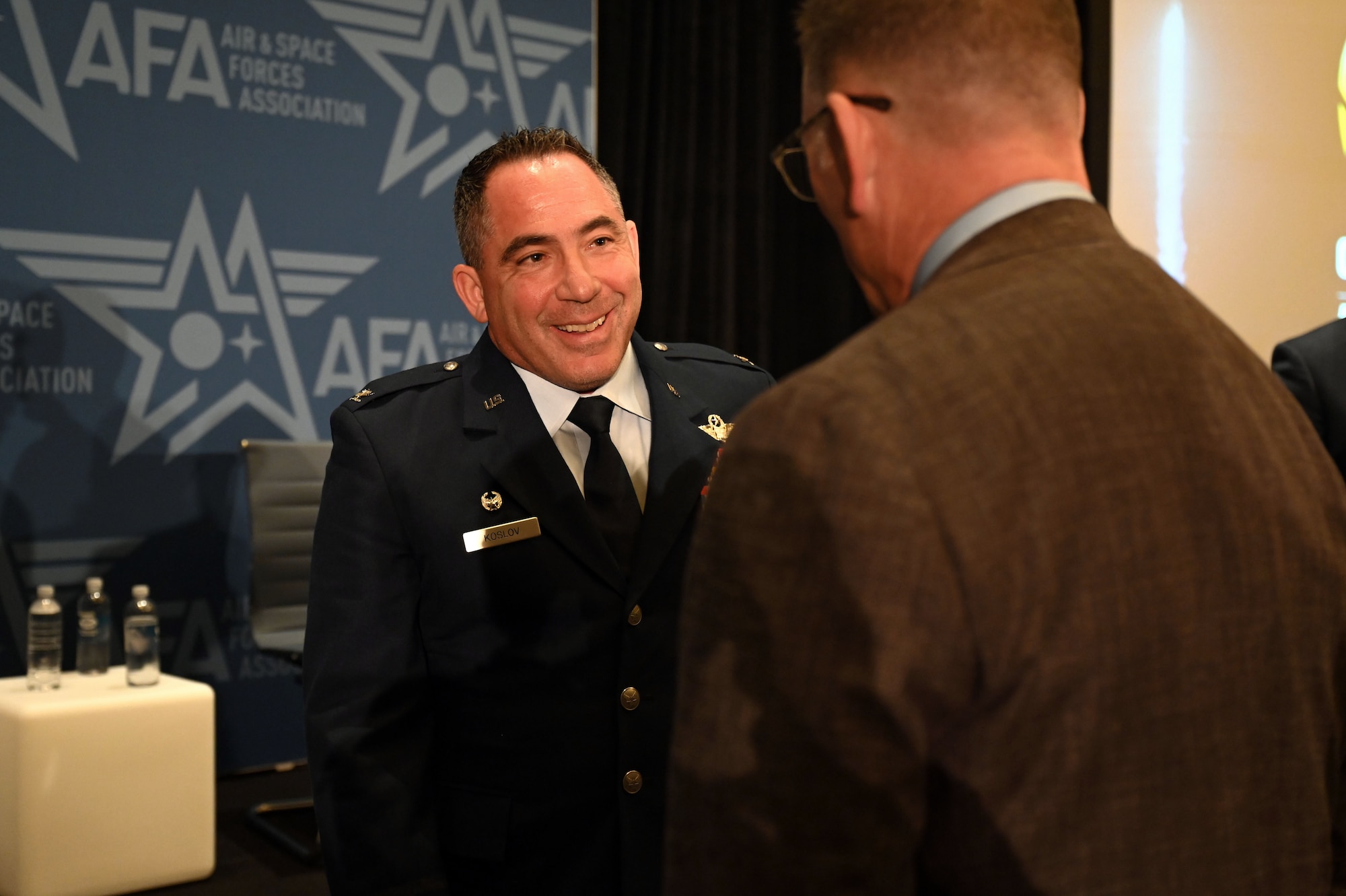 U.S. Air Force Col. Josh Koslov, 350th Spectrum Warfare Wing commander, talks to members after serving as a panelist for Spectrum Renaissance session during the Air & Space Forces Association’s (AFA) Air, Space & Cyber Conference at the Gaylord National Resort & Convention Center in National Harbor, Md., Sept. 13, 2023. During the panel, Koslov explained how the dependability between air assets and the EMS as inseparable and the survivability of Airmen depends on the Air Force achieving and maintaining EMS superiority. (U.S. Air Force photo by Staff Sgt. Ericka A. Woolever)