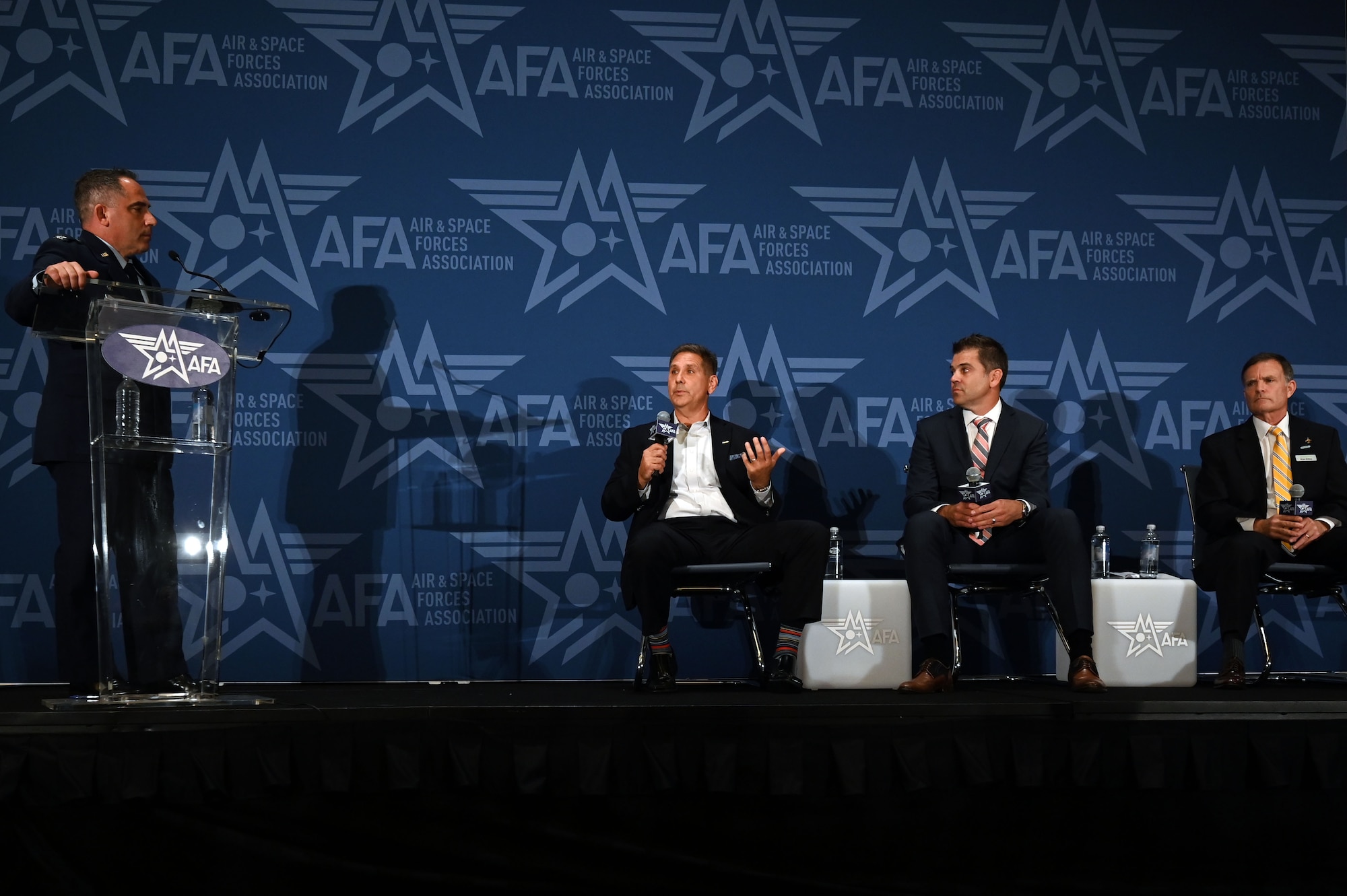 U.S. Air Force Col. Josh Koslov, 350th Spectrum Warfare Wing commander, left, moderates the Cross Cutting Operational Enabler: Electronic Warfare session during the Air & Space Forces Association’s (AFA) Air, Space & Cyber Conference at the Gaylord National Resort & Convention Center in National Harbor, Md., Sept. 13, 2023. During the session the panelist spoke about the path to achieving EMS superiority. They discussed how is more than just an Air Force challenge but a joint challenge. (U.S. Air Force photo by Staff Sgt. Ericka A. Woolever)