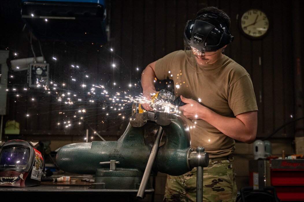 Staff Sgt. Gregory Bailey, 51st Maintenance Squadron metals technician, operates an angle grinder
