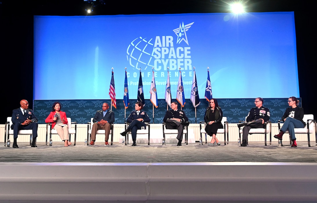 Air Force Chief of Staff Gen. CQ Brown, Jr., Mrs. Sharene Brown, Chief of Space Operations Gen. Chance Saltzman, Mrs. Jennifer Saltzman, Chief Master Sgt. of the Air Force JoAnne S. Bass, Mr. Rahn Bass, Chief Master Sgt. of the Space Force Roger Towberman and Mrs. Rachel Rush take part in a panel discussion
