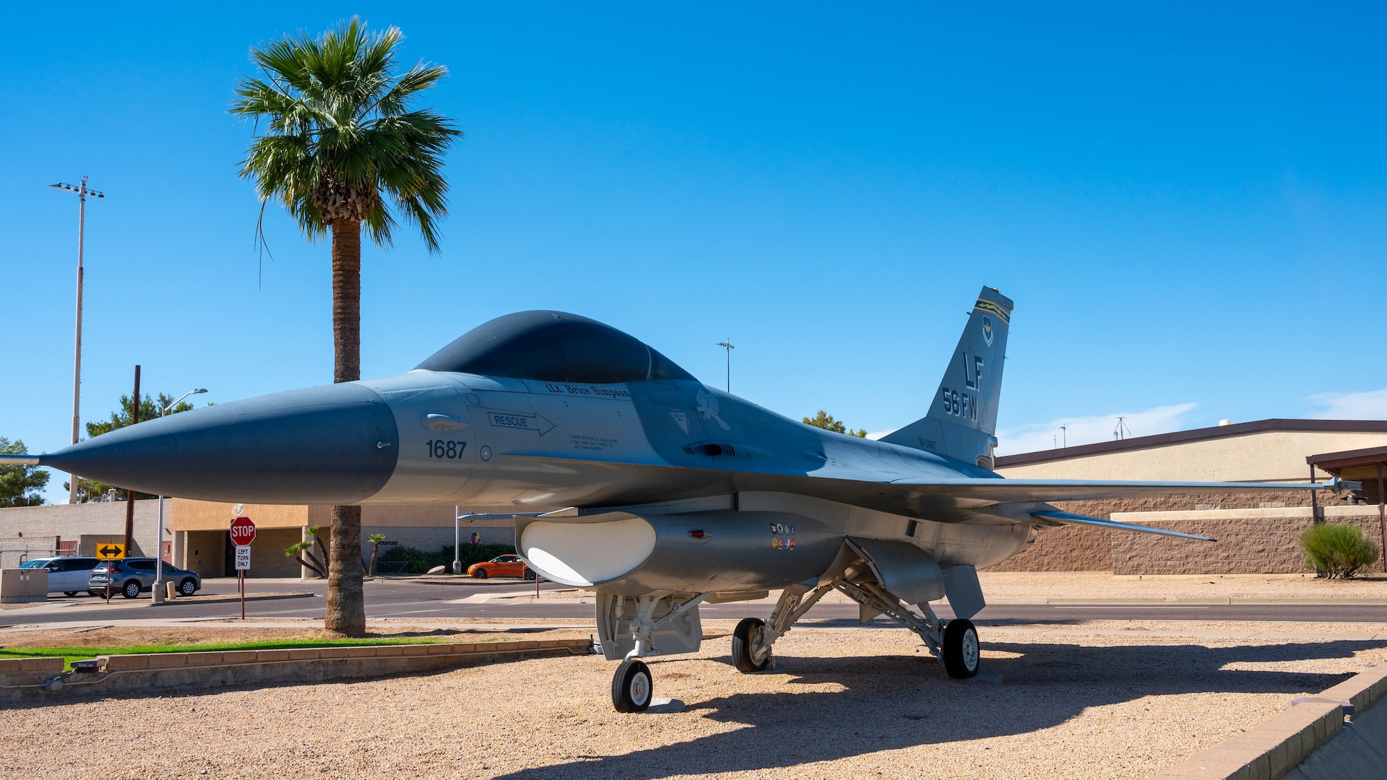 A static display of an F-16 Fighting Falcon bearing the name of U.S. Air Force 1st Lt. Brice Simpson, rests outside of the command building at Luke Air Force Base, Arizona, Sept 14, 2023.