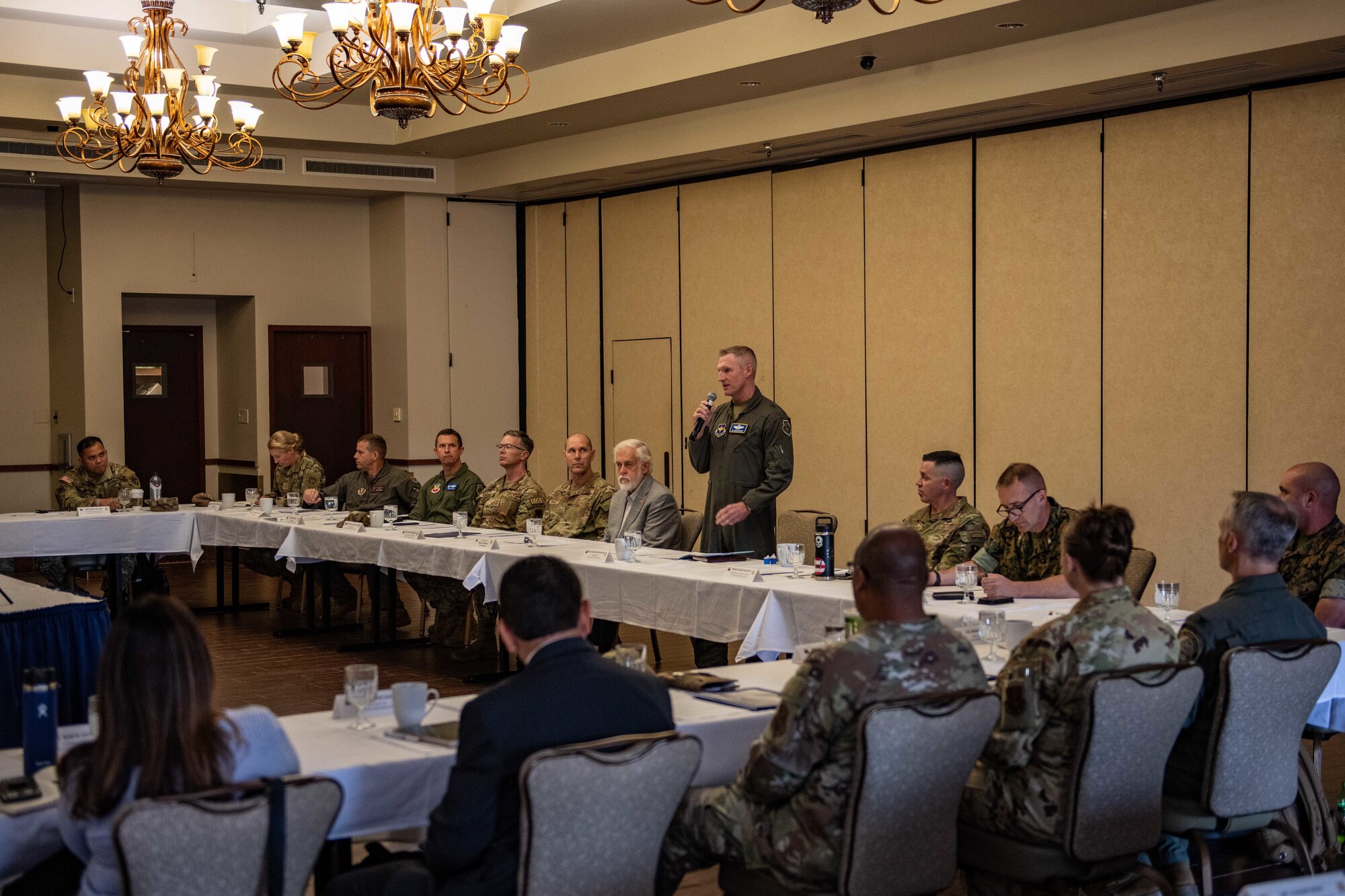 The commander of the 56th Fighter Wing addresses a crowd of military commanders at the Arizona Commanders Summit.