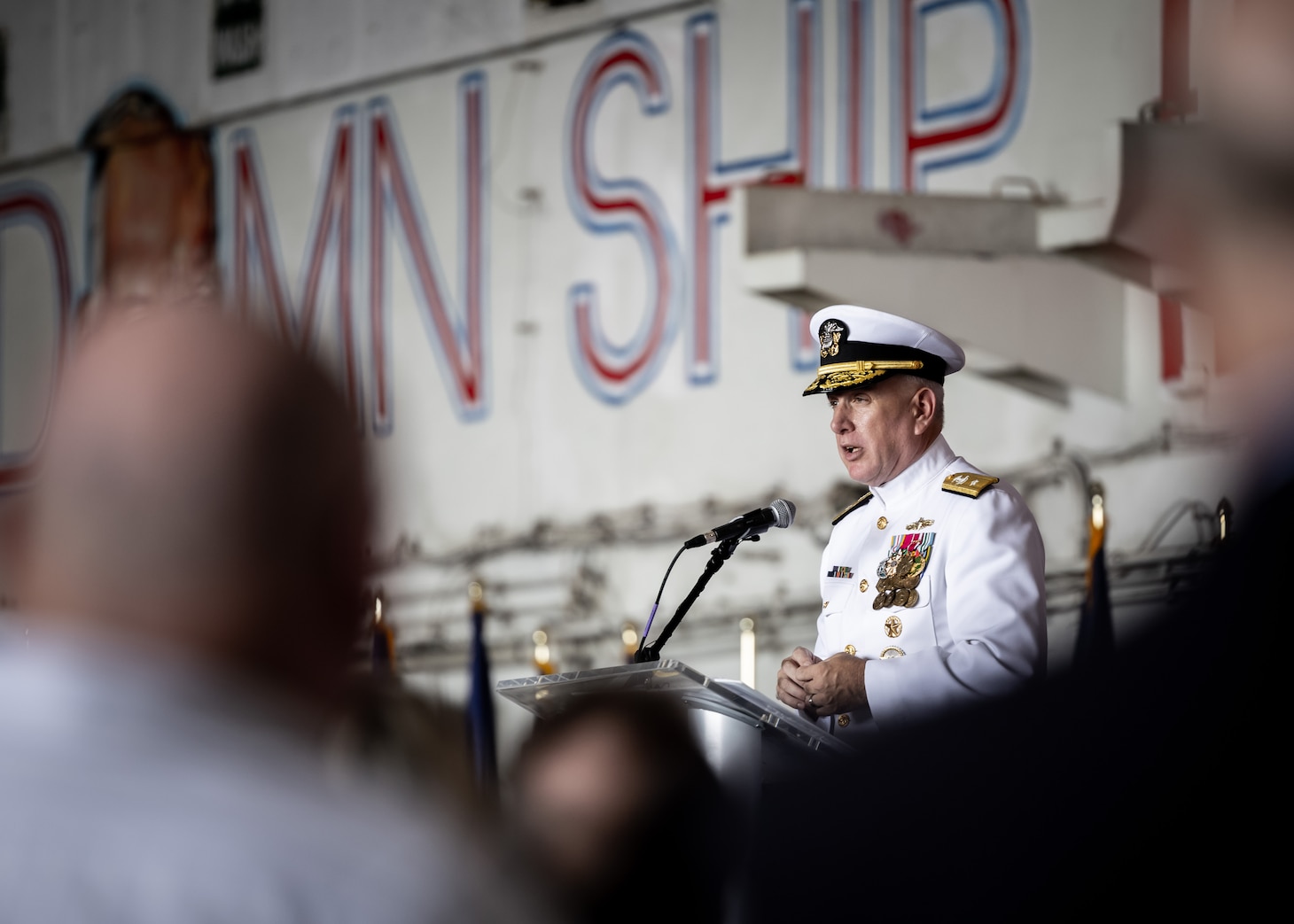 Rear Adm. Philip Sobek, commander, Military Sealift Command (MSC), delivers remarks aboard USS Dwight D. Eisenhower (CVN 69) during MSC’s change of command ceremony held on board the ship, Sept. 8, 2023.