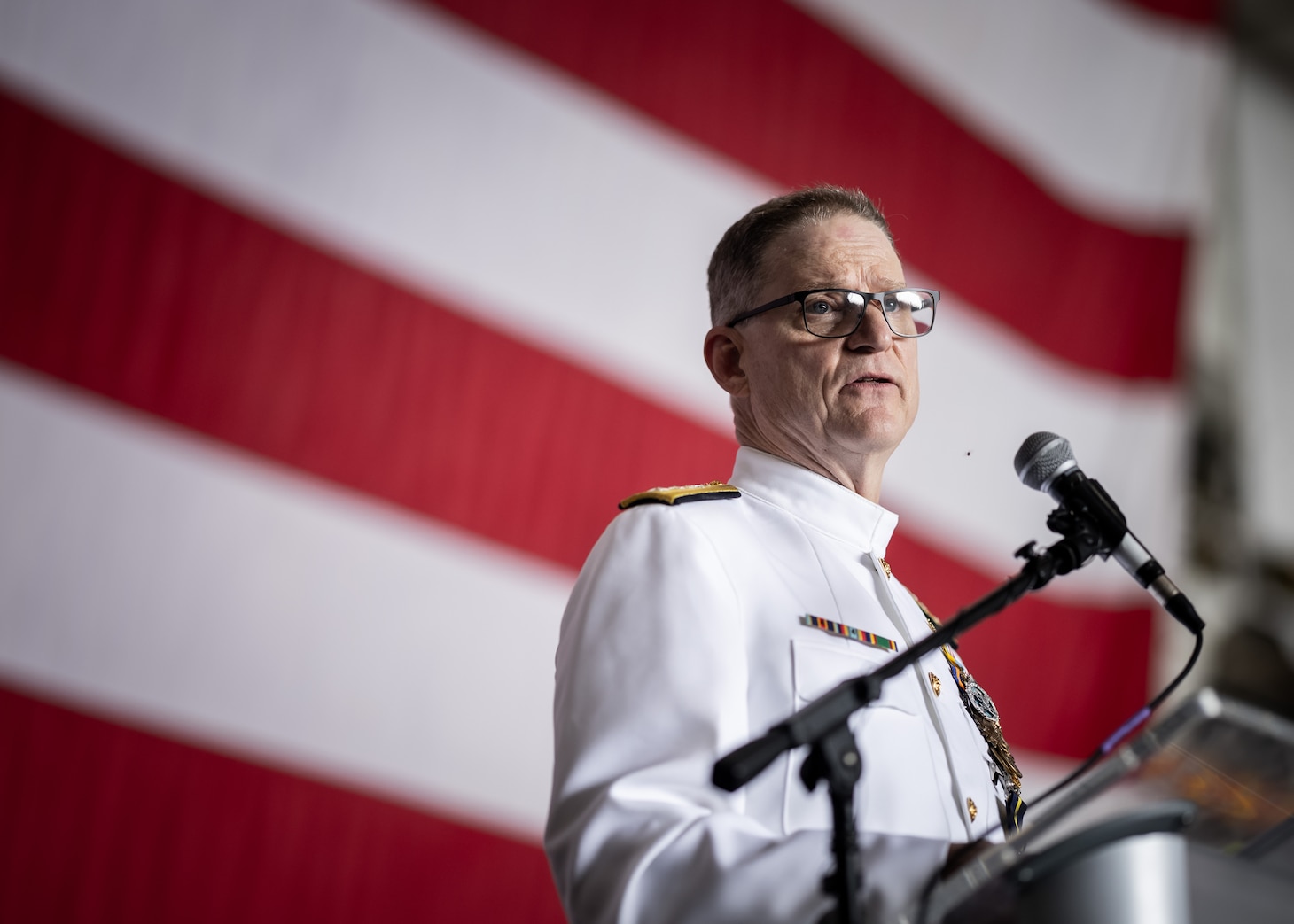 Rear Adm. (Ret.) Michael A. Wettlaufer, commander, Military Sealift Command (MSC), delivers remarks aboard USS Dwight D. Eisenhower (CVN 69) during his retirement portion of MSC’s change of command ceremony held on board the ship, Sept. 8, 2023.