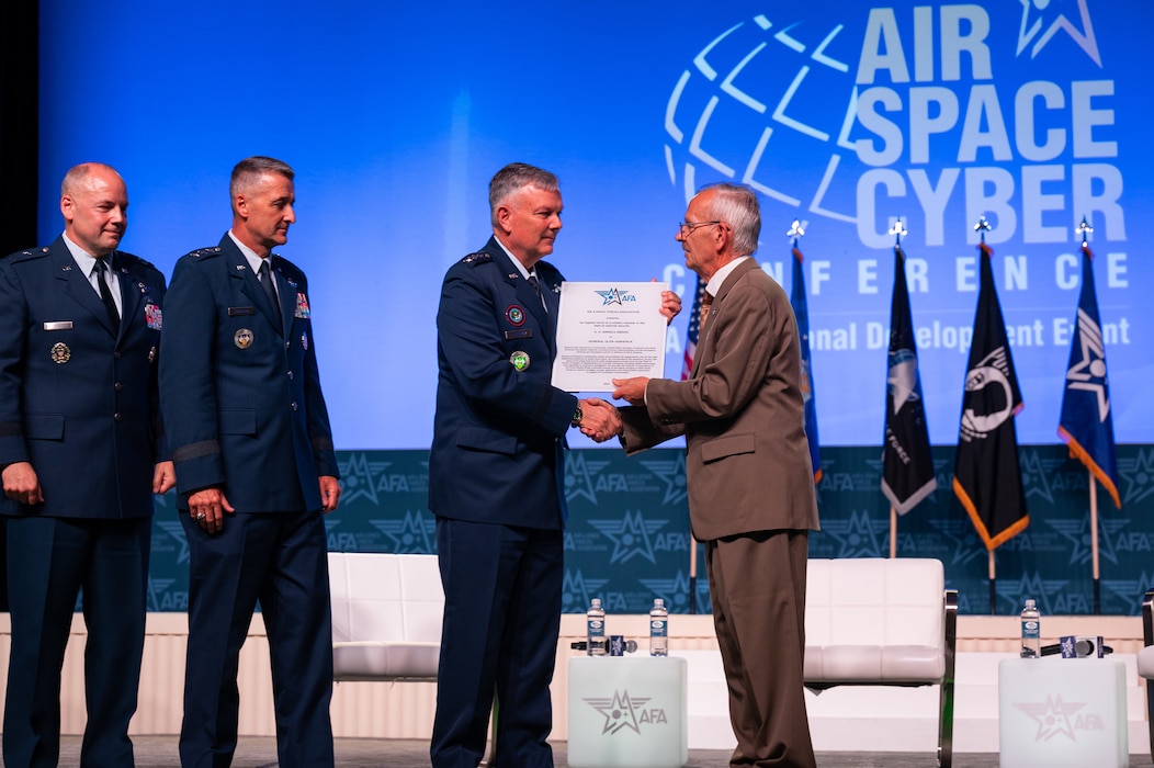 U.S. Air Force Gen. Glen D. VanHerck, center, commander, U.S. Northern Command and North American Aerospace Defense Command, is presented the H. H. Arnold Award by the Air & Space Forces Association at the 2023 Air, Space & Cyber Conference in the National Harbor, Maryland, Sep. 13, 2023.