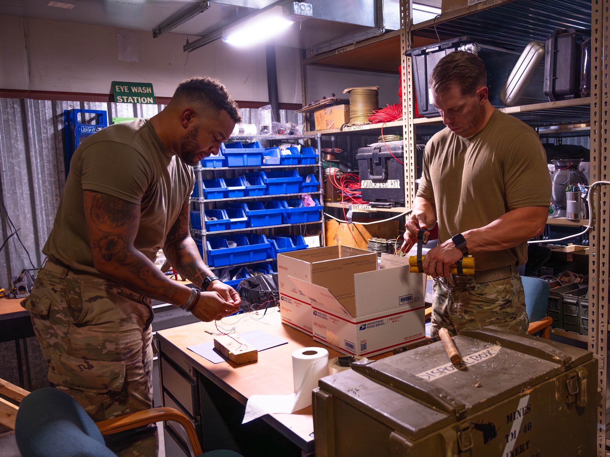 U.S. Air Force Tech. Sgt. James Vossah (left) and Tech. Sgt. Tyler Paul (right), 56th Civil Engineer Squadron explosive ordnance disposal technicians, prepare simulated explosives during training exercise Road RAPTER or Radiological Assistance Program Training for Emergency Response Sept. 6, 2023, at Luke Air Force Base, Arizona.