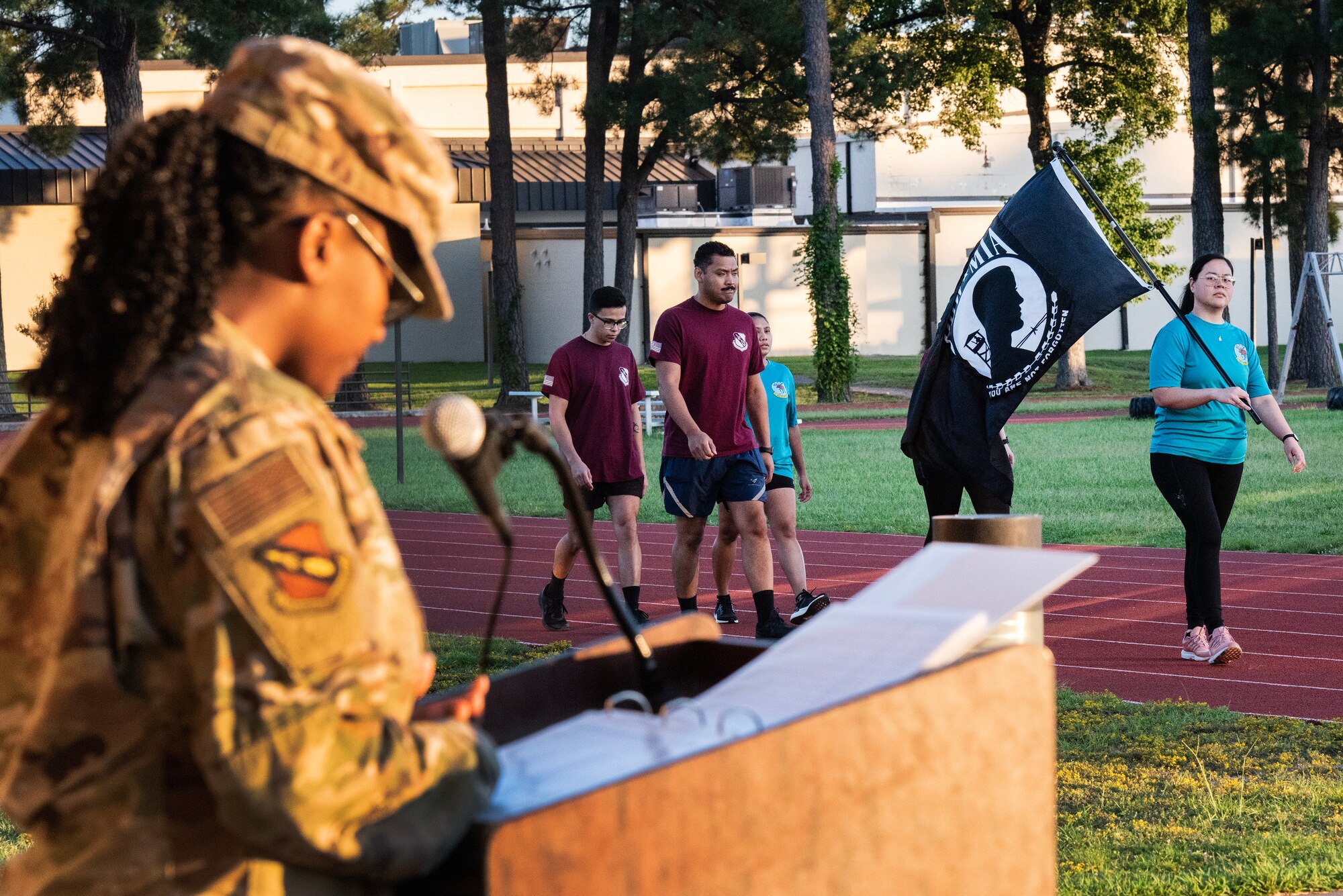 Airmen assigned to the 4th Health Care Operations Squadron carry the POW/MIA flag as Senior Airman Taylor Hunter, 4th Fighter Wing public affairs journeyman, reads the names of prisoners of war and those missing in action during a 24-hour vigil event as part of POW/MIA Recognition Day at Seymour Johnson Air Force Base, North Carolina, Sept. 15, 2023.
