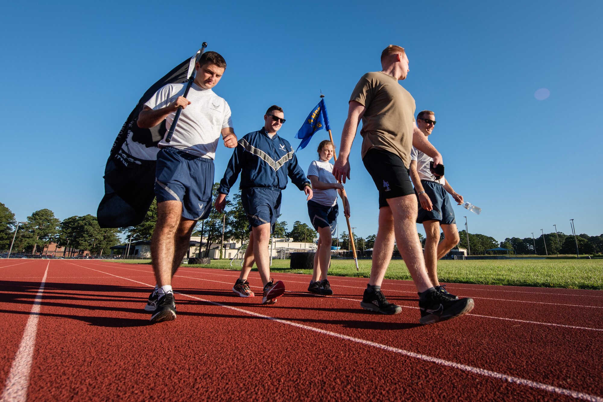 Airmen, 4th Civil Engineer Squadron, carry the POW/MIA flag during a 24-hour vigil event as part of POW/MIA Recognition Day at Seymour Johnson Air Force Base, North Carolina, Sept. 15, 2023.