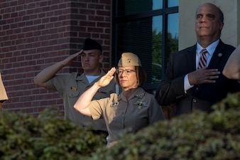 VCNO Adm. Lisa Franchetti renders honors during a commemoration of the 10th anniversary of the Washington Navy Yard shooting.