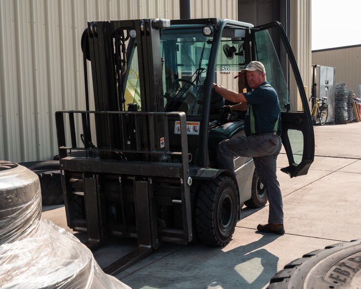 Stephen Bueschel, 5th Logistics Readiness Squadron property consolidation warehouse operator, poses for a photo at Minot Air Force Base, North Dakota, Aug. 30, 2023. Bueschel manages the staging area for reutilization of Minot AFB property. (U.S. Air Force photo by Senior Airman Evan Lichtenhan)