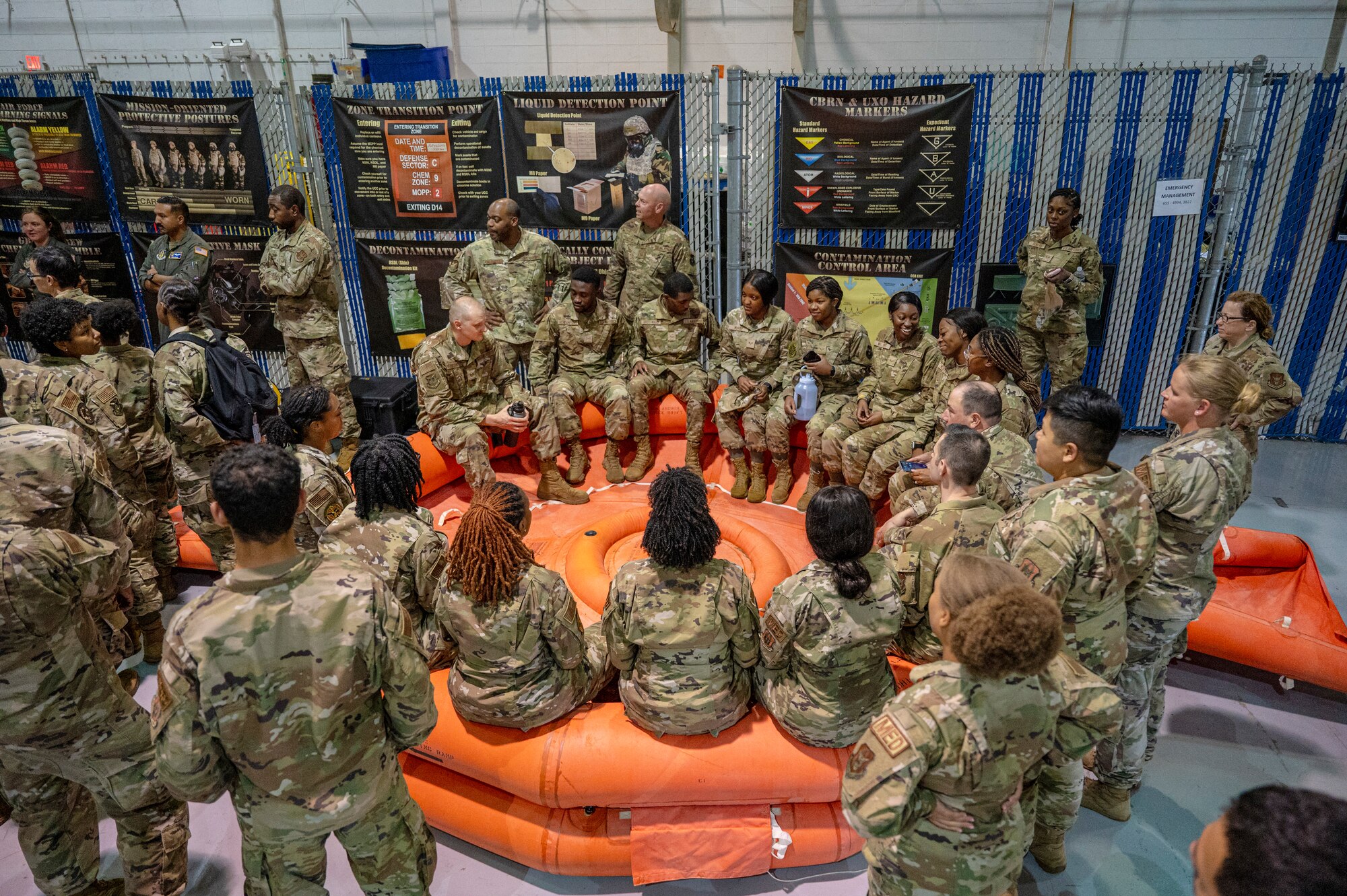 Airmen sit in a life-raft during training