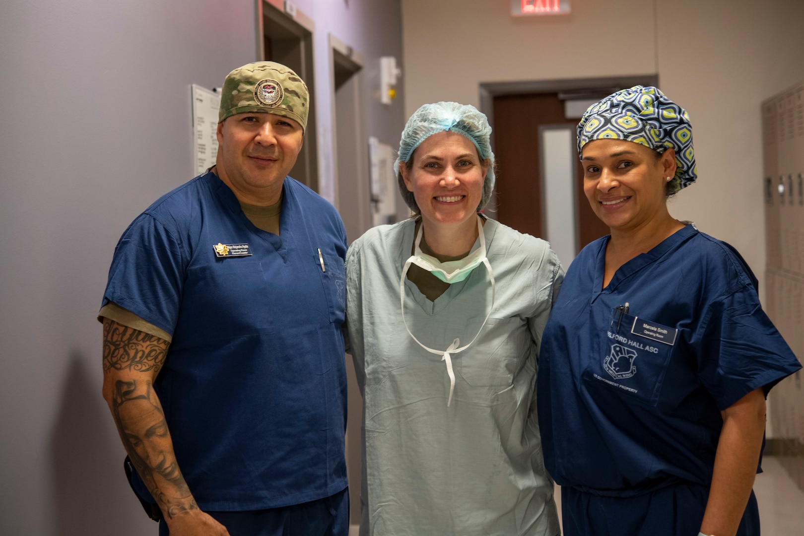 military medical professionals pose and smile for photo