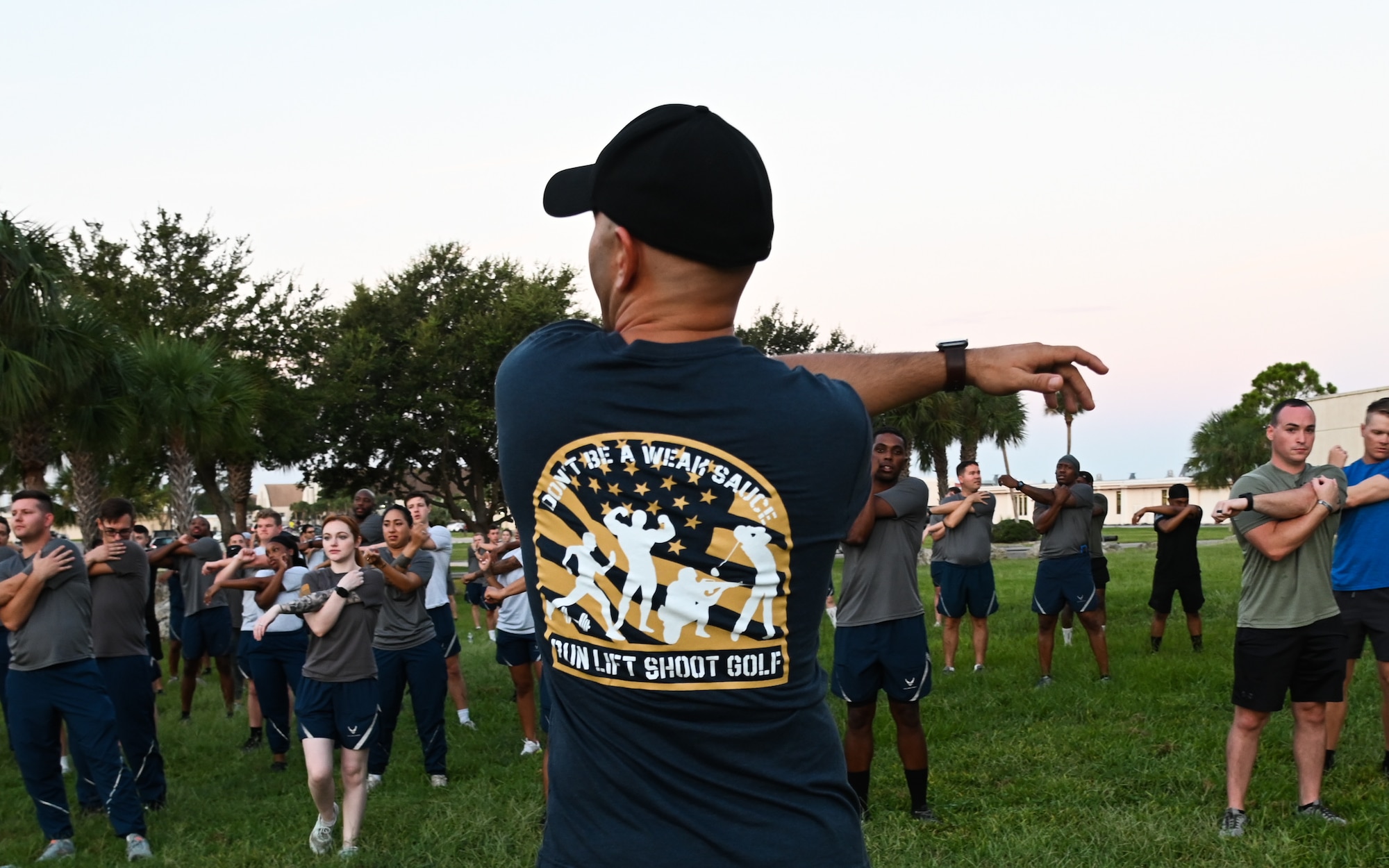 Members of the 6th Security Forces Squadron wait at the finish line at the 14th annual Helton Hall 5K at MacDill Air Force Base, Florida, Sept. 13, 2023.