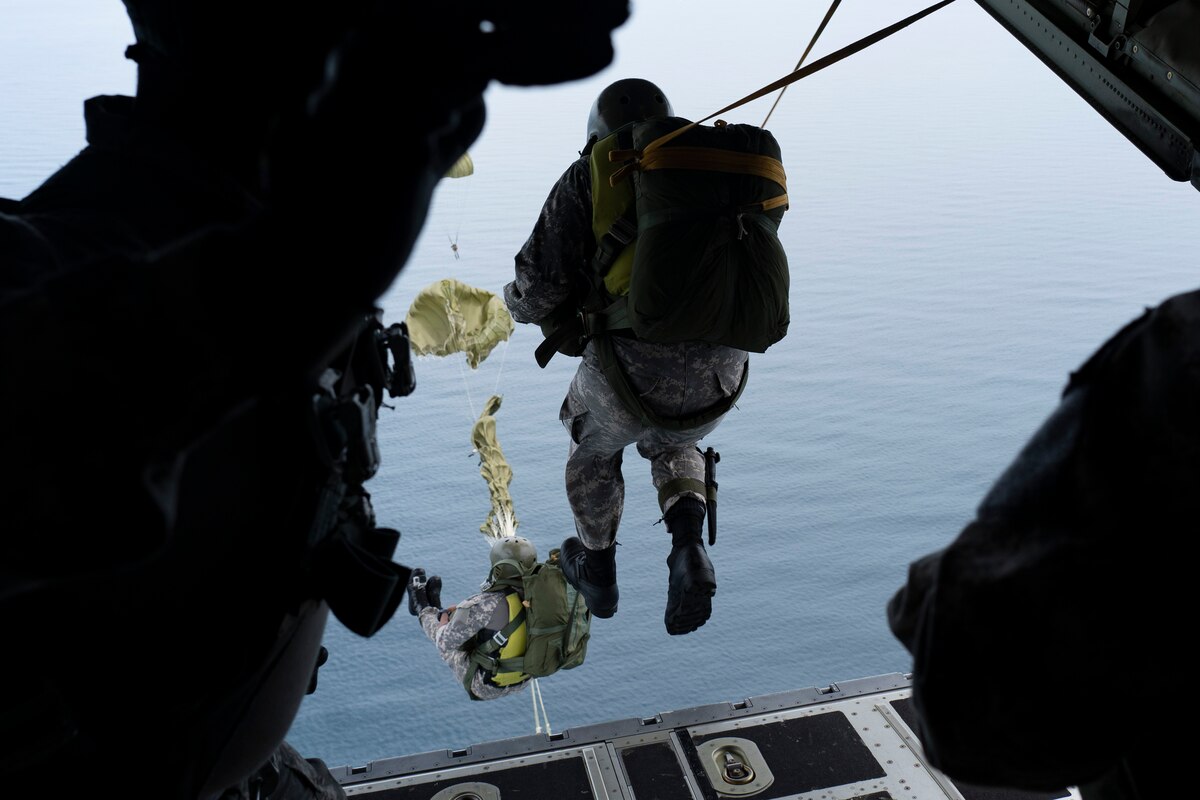 Photo of military personnel performing static line jumps