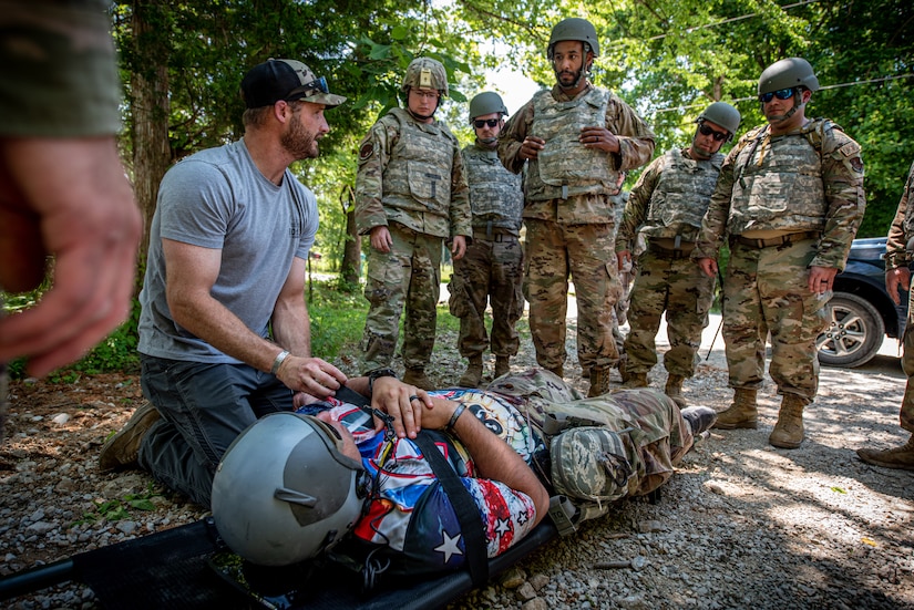 Airmen from the Kentucky Air National Guard’s 123rd Civil Engineer Squadron simulate a medical evacuation during a training exercise in Shepherdsville, Ky., June 2, 2023. The purpose of the training was to promote multi-capable Airmen by training them on skills outside of their primary jobs. (U.S. Air National Guard photo by Tech. Sgt. Joshua Horton)