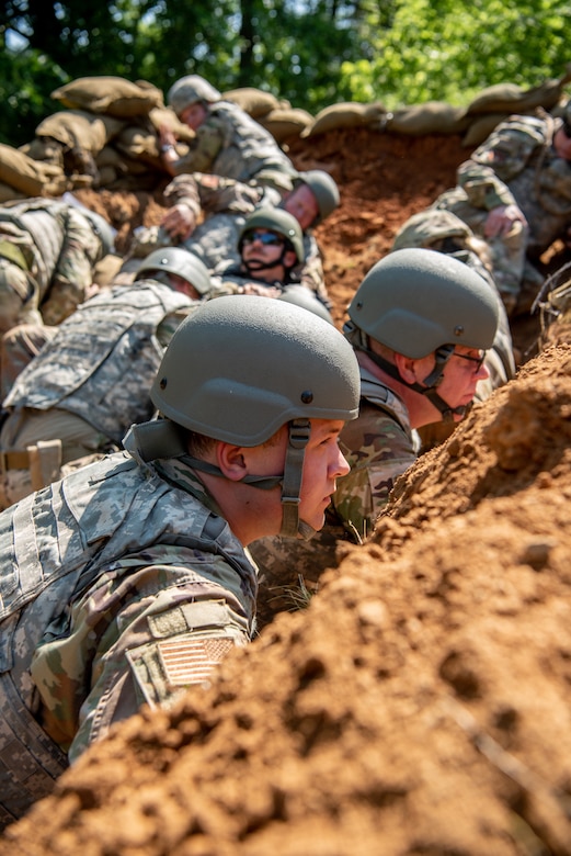 Airmen from the Kentucky Air National Guard’s 123rd Civil Engineer Squadron utilize defensive fighting positions during a training exercise in Shepherdsville, Ky., June 2, 2023. The purpose of the training was to promote multi-capable Airmen by training them on skills outside of their primary jobs. (U.S. Air National Guard photo by Tech. Sgt. Joshua Horton)