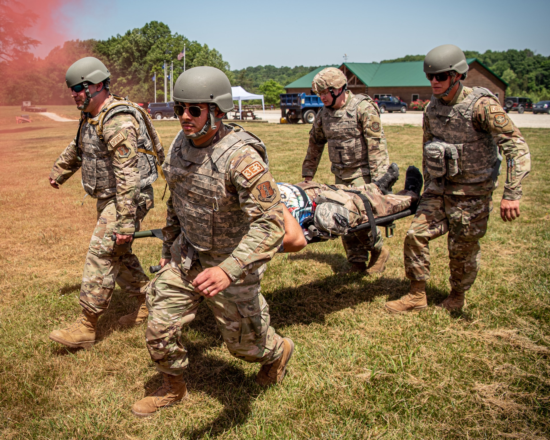 Airmen from the Kentucky Air National Guard’s 123rd Civil Engineer Squadron simulate medical evacuation during a training exercise in Shepherdsville, Ky., June 2, 2023. The purpose of the training was to promote multi-capable Airmen by training them on skills outside of their primary jobs. (U.S. Air National Guard photo by Tech. Sgt. Joshua Horton)