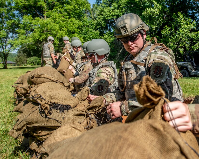 Airmen from the Kentucky Air National Guard’s 123rd Civil Engineer Squadron construct defensive fighting positions during a training exercise in Shepherdsville, Ky., June 2, 2023. The purpose of the training was to promote multi-capable Airmen by training them on skills outside of their primary jobs. (U.S. Air National Guard photo by Tech. Sgt. Joshua Horton)