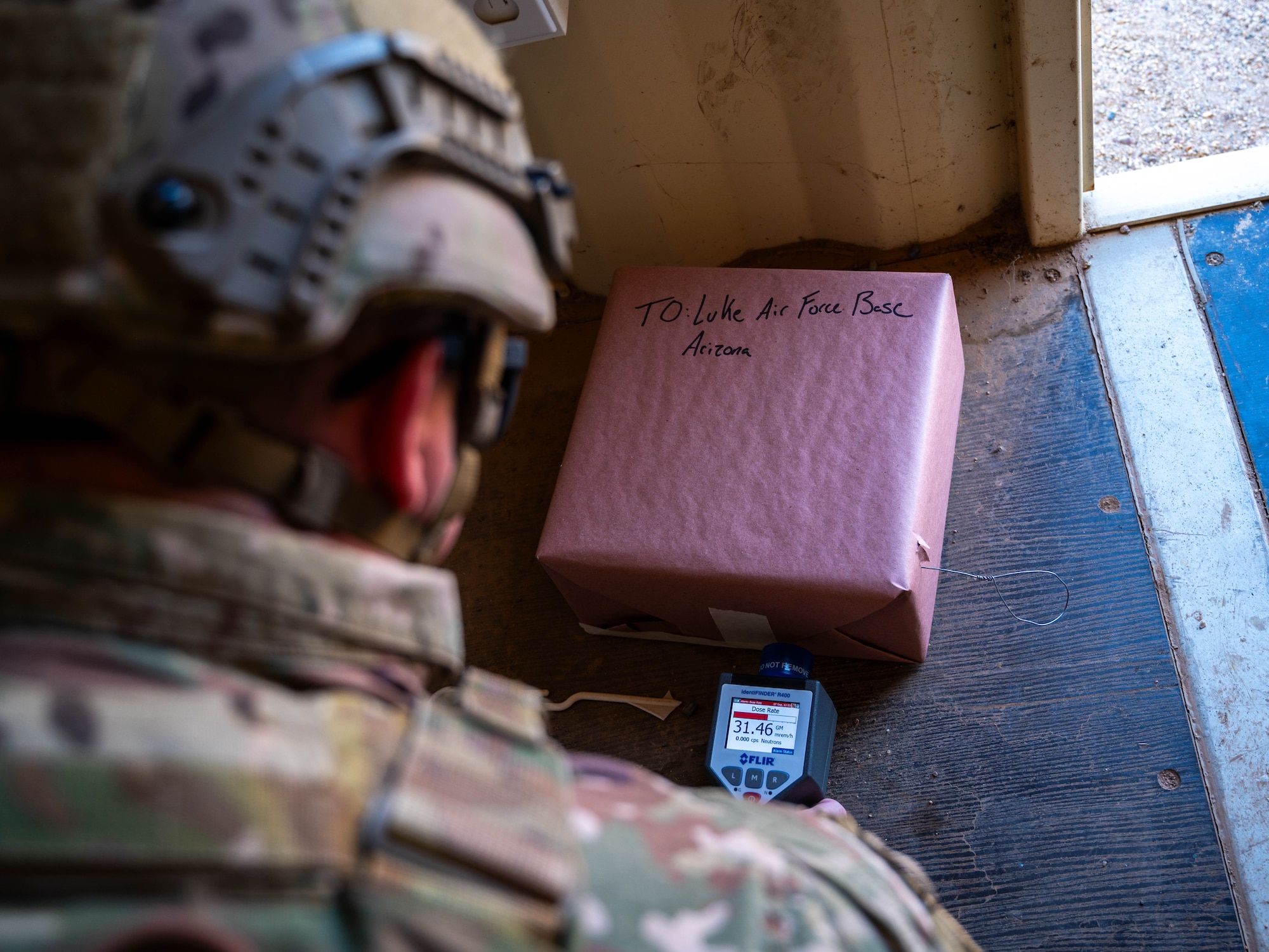 U.S. Air Force Staff Sgt. Zackary Stringer, 56th Civil Engineer Squadron explosive ordnance disposal technician, uses a radiological isotope identification device during training exercise Road RAPTER or Radiological Assistance Program Training for Emergency Response Sept. 7, 2023, at Luke Air Force Base, Arizona.