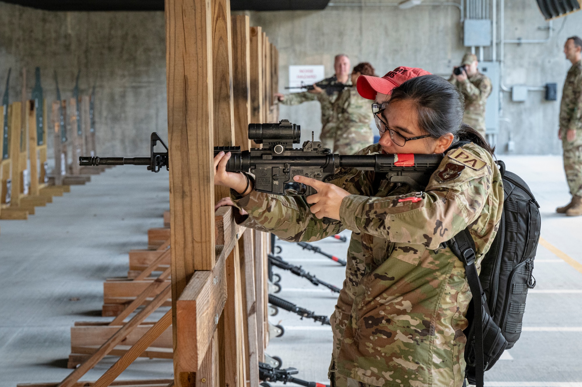 An Airman holds a rifle